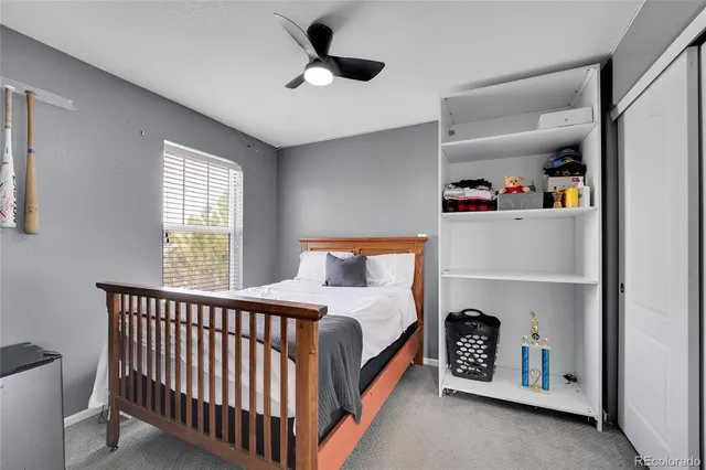 a bedroom with bed and window