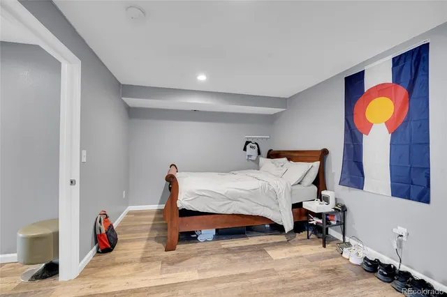 a bathroom with a bathtub sink and mirror
