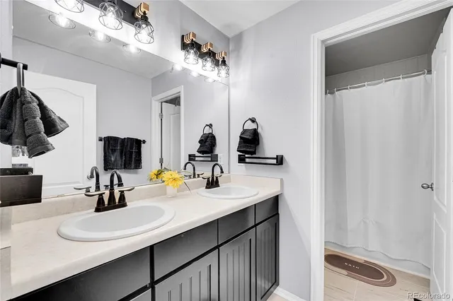 a bathroom with a sink a toilet and vanity