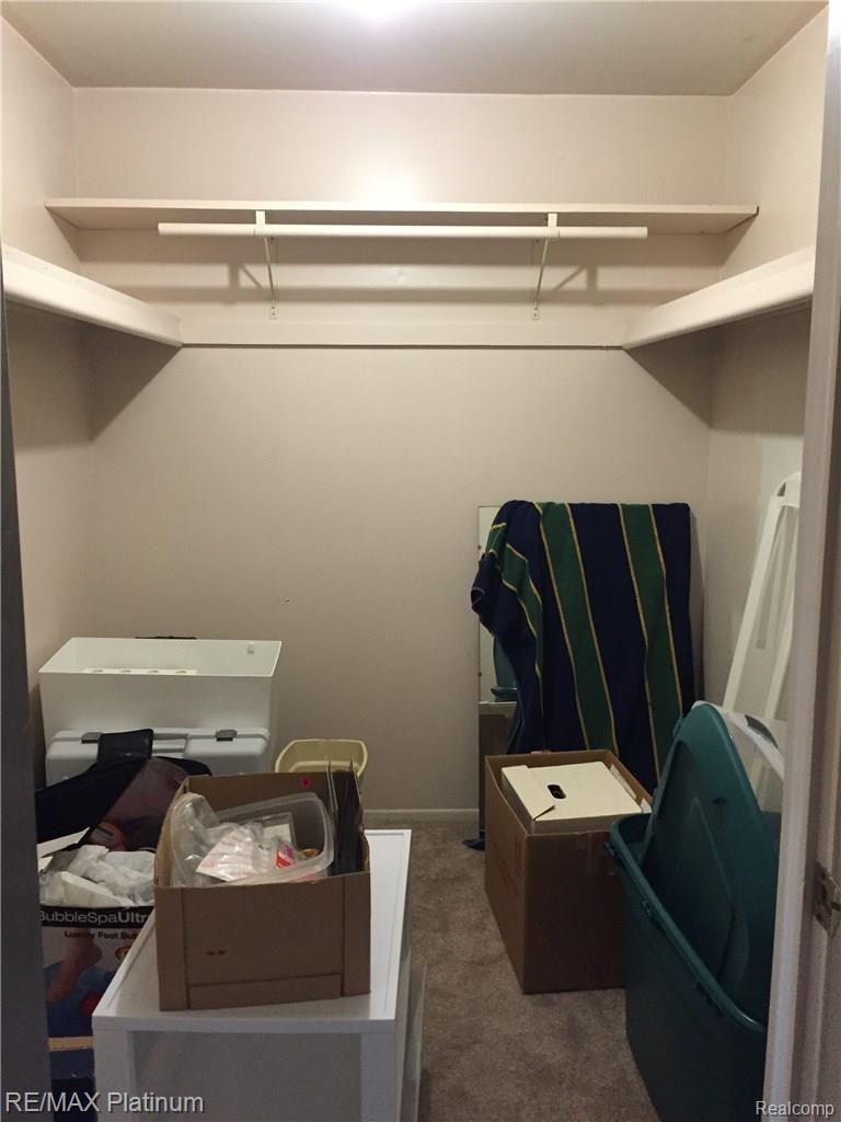9335 Bennett Lake Road Fenton, MI 48430 - Photo 29 of 33 Extra walk-in closet upstairs for your seasonal clothes or holiday decorations.