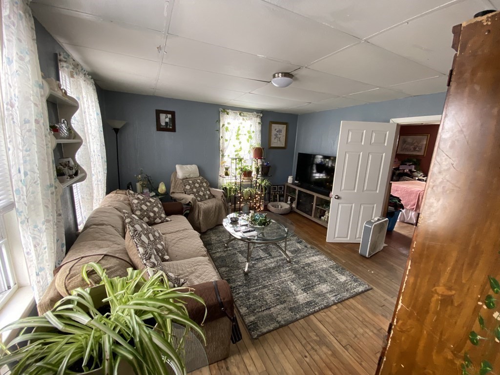 3 Chestnut Street Dudley, MA 01571 - Photo 11 of 20 a living room with furniture rug and a window