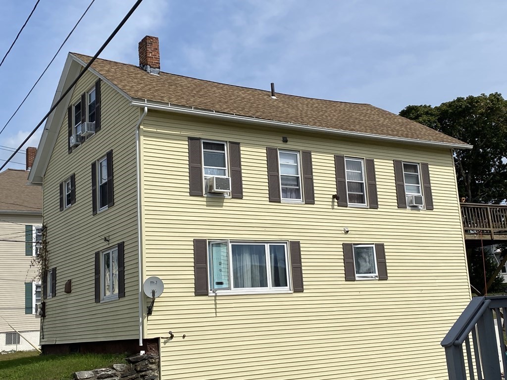 3 Chestnut Street Dudley, MA 01571 - Photo 18 of 20 a front view of a house with a balcony