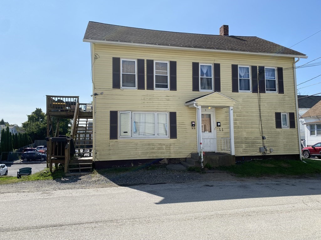 3 Chestnut Street Dudley, MA 01571 - Photo 19 of 20 a front view of a house with a yard