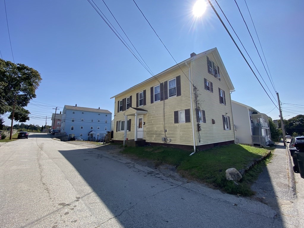 3 Chestnut Street Dudley, MA 01571 - Photo 20 of 20 a front view of a house with a yard