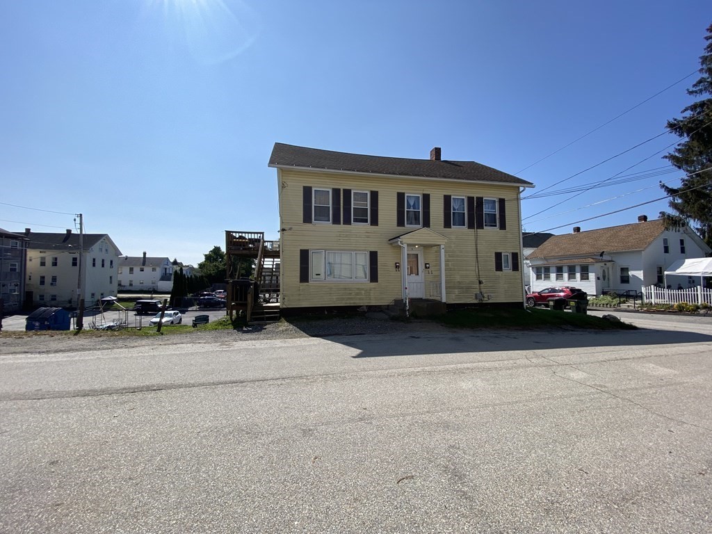 3 Chestnut Street Dudley, MA 01571 - Photo 3 of 20 a car parked in front of a house