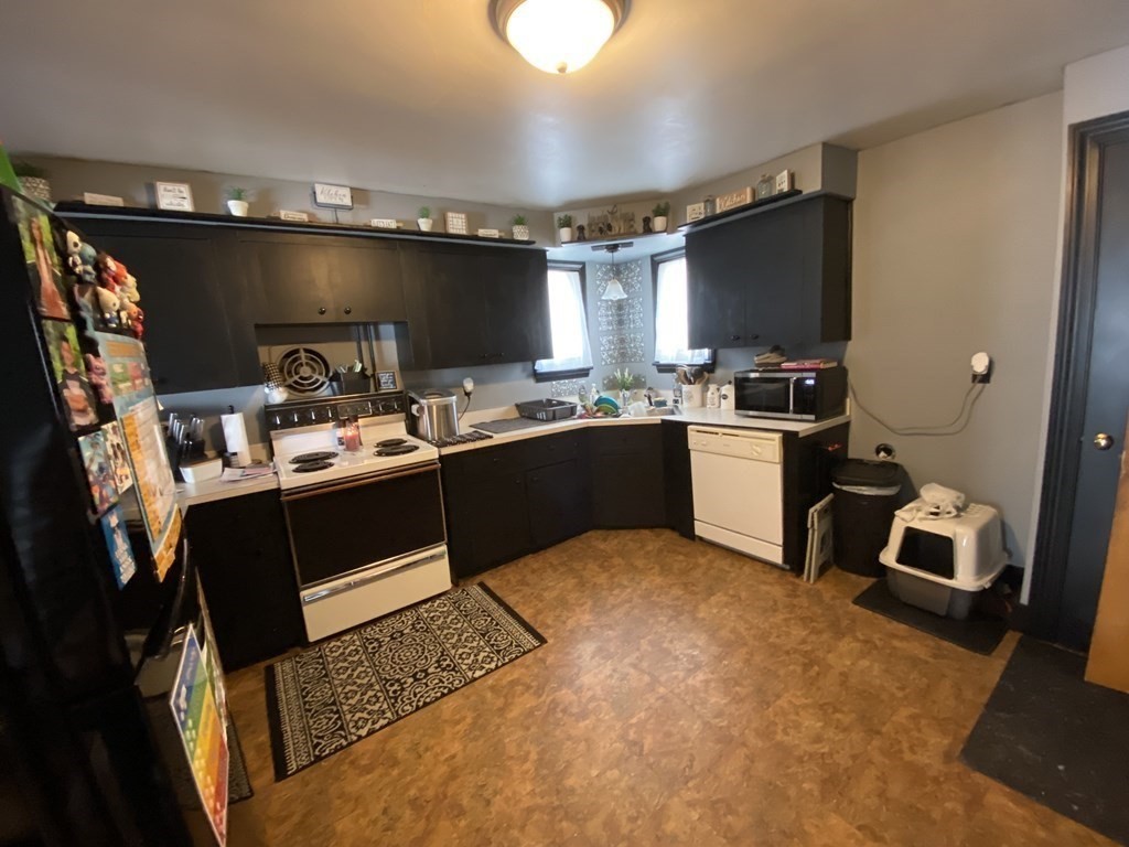 3 Chestnut Street Dudley, MA 01571 - Photo 4 of 20 a kitchen with a sink and cabinets