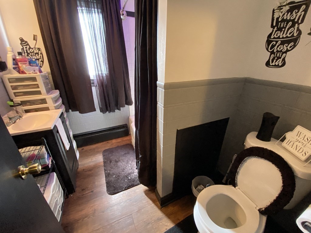 3 Chestnut Street Dudley, MA 01571 - Photo 5 of 20 a bathroom with a toilet mirror and vanity