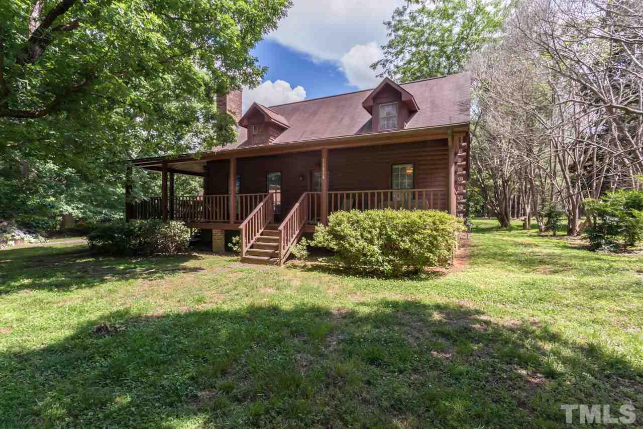 11816 Possum Track Road Raleigh, NC 27614 - Photo 1 of 25 a view of a house with backyard and a tree