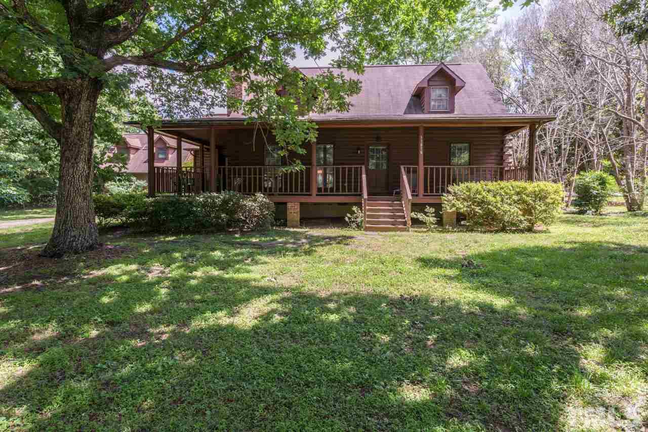 11816 Possum Track Road Raleigh, NC 27614 - Photo 2 of 25 a front view of a house with a garden and porch