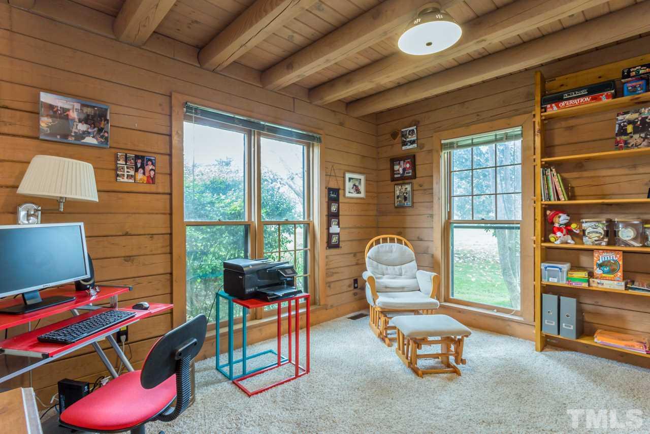 11816 Possum Track Road Raleigh, NC 27614 - Photo 14 of 25 a room with lots of furniture and a potted plant