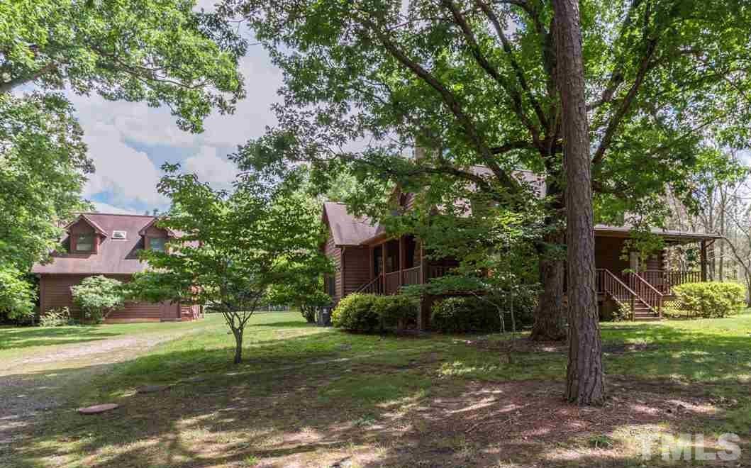 11816 Possum Track Road Raleigh, NC 27614 - Photo 3 of 25 a view of a yard in front of a house with a tree