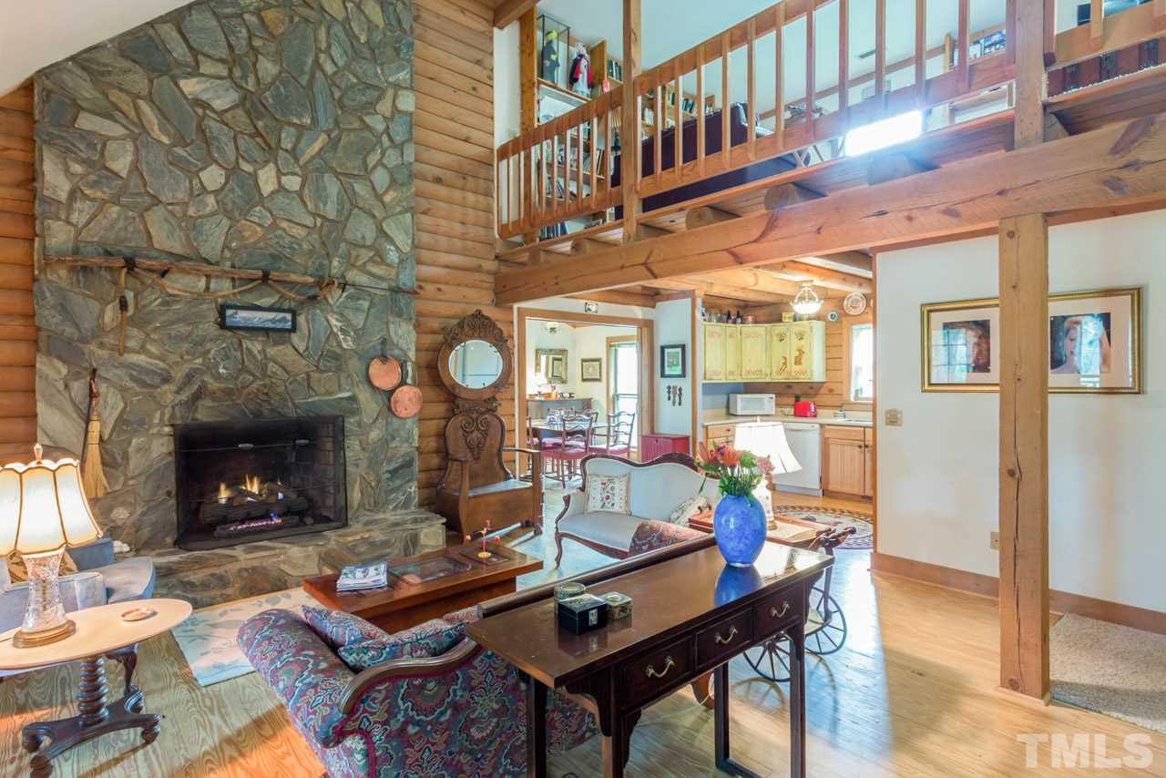 11816 Possum Track Road Raleigh, NC 27614 - Photo 6 of 25 a living room with fireplace furniture and a fireplace