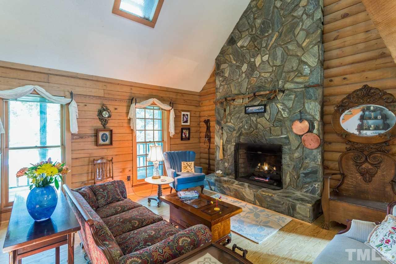 11816 Possum Track Road Raleigh, NC 27614 - Photo 7 of 25 a living room with furniture and a fireplace