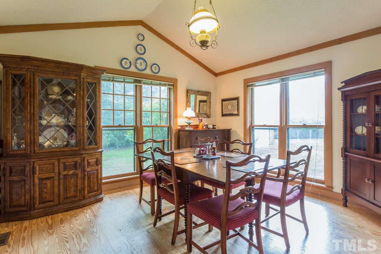 11816 Possum Track Road Raleigh, NC 27614 - Photo 9 of 25 a view of a dining room with furniture window and outside view
