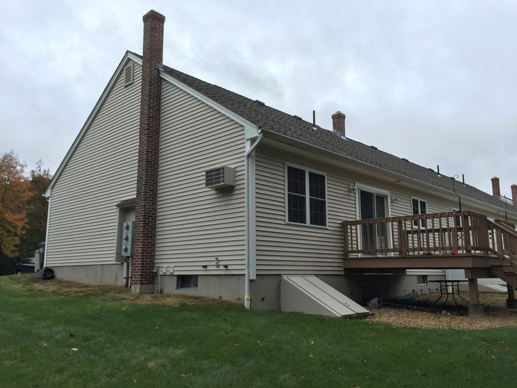 8 Autumn Woods Drive, Unit 8 Rutland, MA 01543 - Photo 2 of 16 a view of a house with a yard