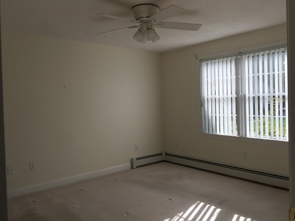 8 Autumn Woods Drive, Unit 8 Rutland, MA 01543 - Photo 9 of 16 an empty room with a window