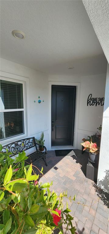 1823 Spring Shower Circle Kissimmee, FL 34744 - Photo 1 of 38 a bed room with a bed and a flat screen tv