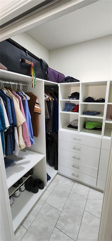 1823 Spring Shower Circle Kissimmee, FL 34744 - Photo 11 of 38 a view of walk in closet with clothes and shoes