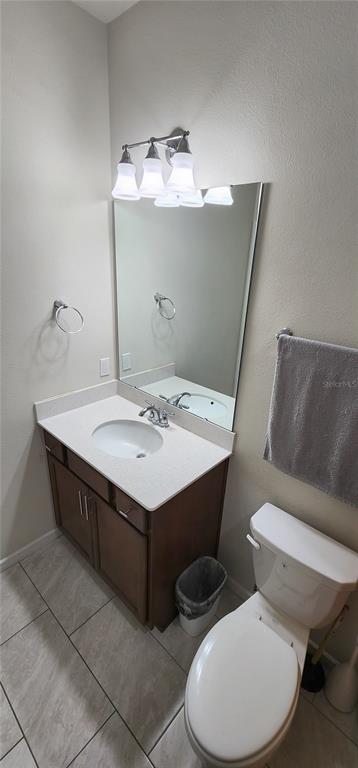 1823 Spring Shower Circle Kissimmee, FL 34744 - Photo 20 of 38 a bathroom with a sink a toilet and mirror