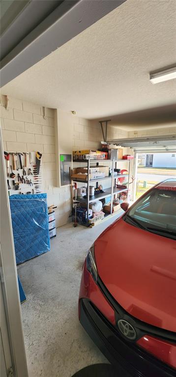 1823 Spring Shower Circle Kissimmee, FL 34744 - Photo 30 of 38 a room with furniture and a flat screen tv