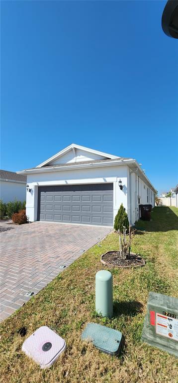 1823 Spring Shower Circle Kissimmee, FL 34744 - Photo 33 of 38 a front view of a house with garden