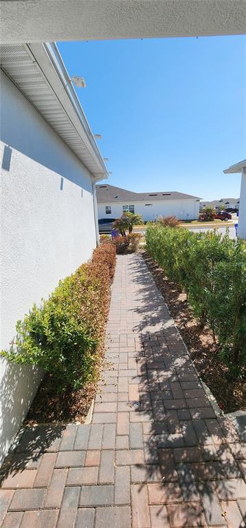 1823 Spring Shower Circle Kissimmee, FL 34744 - Photo 35 of 38 a view of a pathway both side of yard