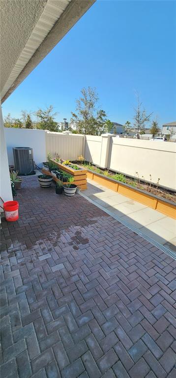 1823 Spring Shower Circle Kissimmee, FL 34744 - Photo 36 of 38 a view of a swimming pool and an outdoor seating