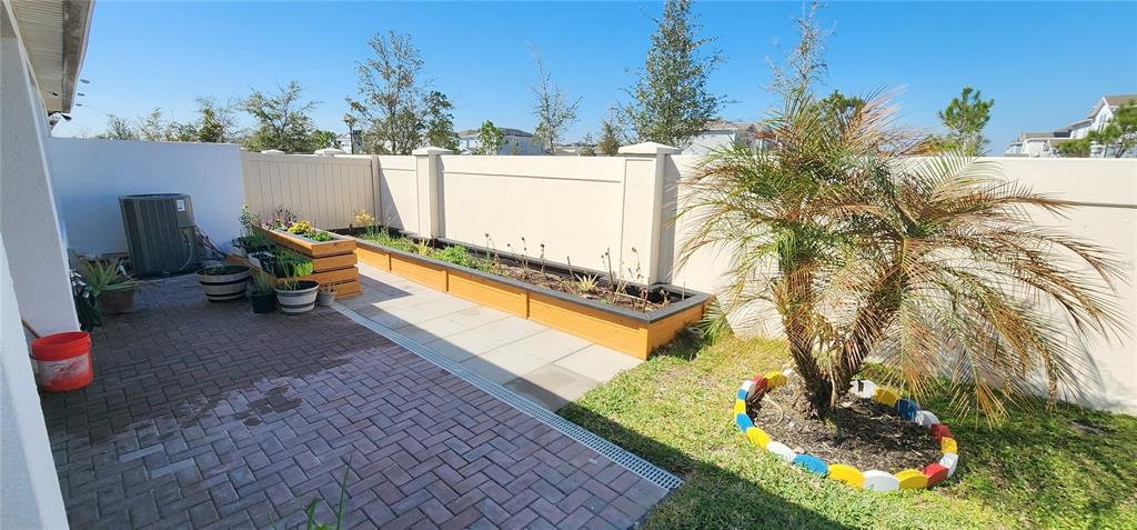 1823 Spring Shower Circle Kissimmee, FL 34744 - Photo 37 of 38 a view of swimming pool with a patio and a yard