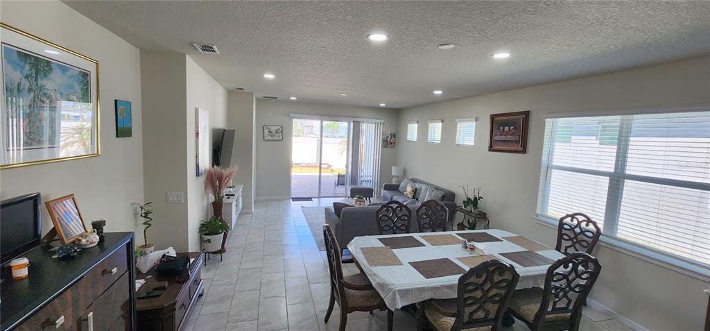 1823 Spring Shower Circle Kissimmee, FL 34744 - Photo 7 of 38 a view of a dining room with furniture