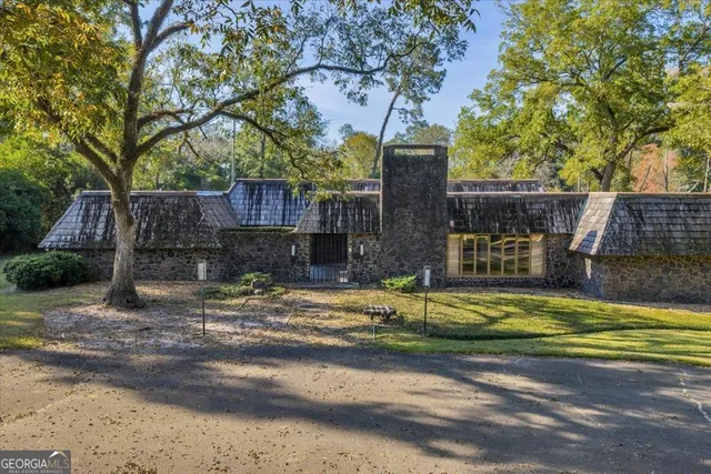 a view of a trees in front of a house