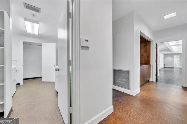 a view of a street with a building in the background