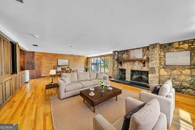 a living room with furniture fireplace and a flat screen tv