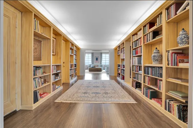 a view of livingroom with furniture and book shelf