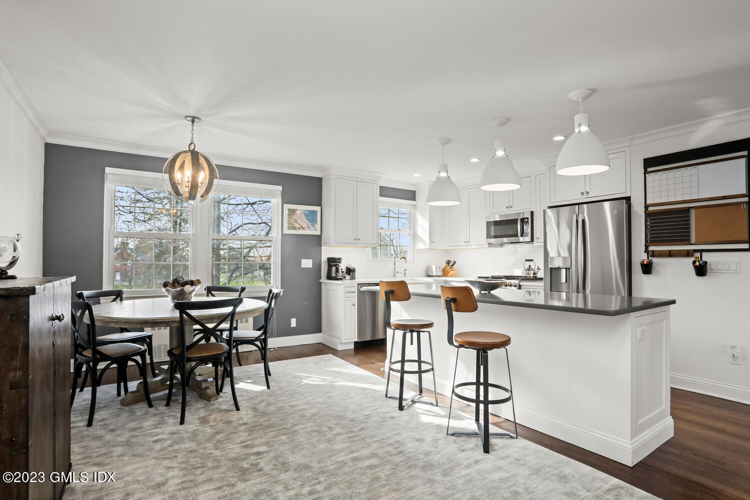 140 Putnam Park, Unit 140 Greenwich, CT 06830 - Photo 1 of 15 a view of a dining room with furniture window and wooden floor