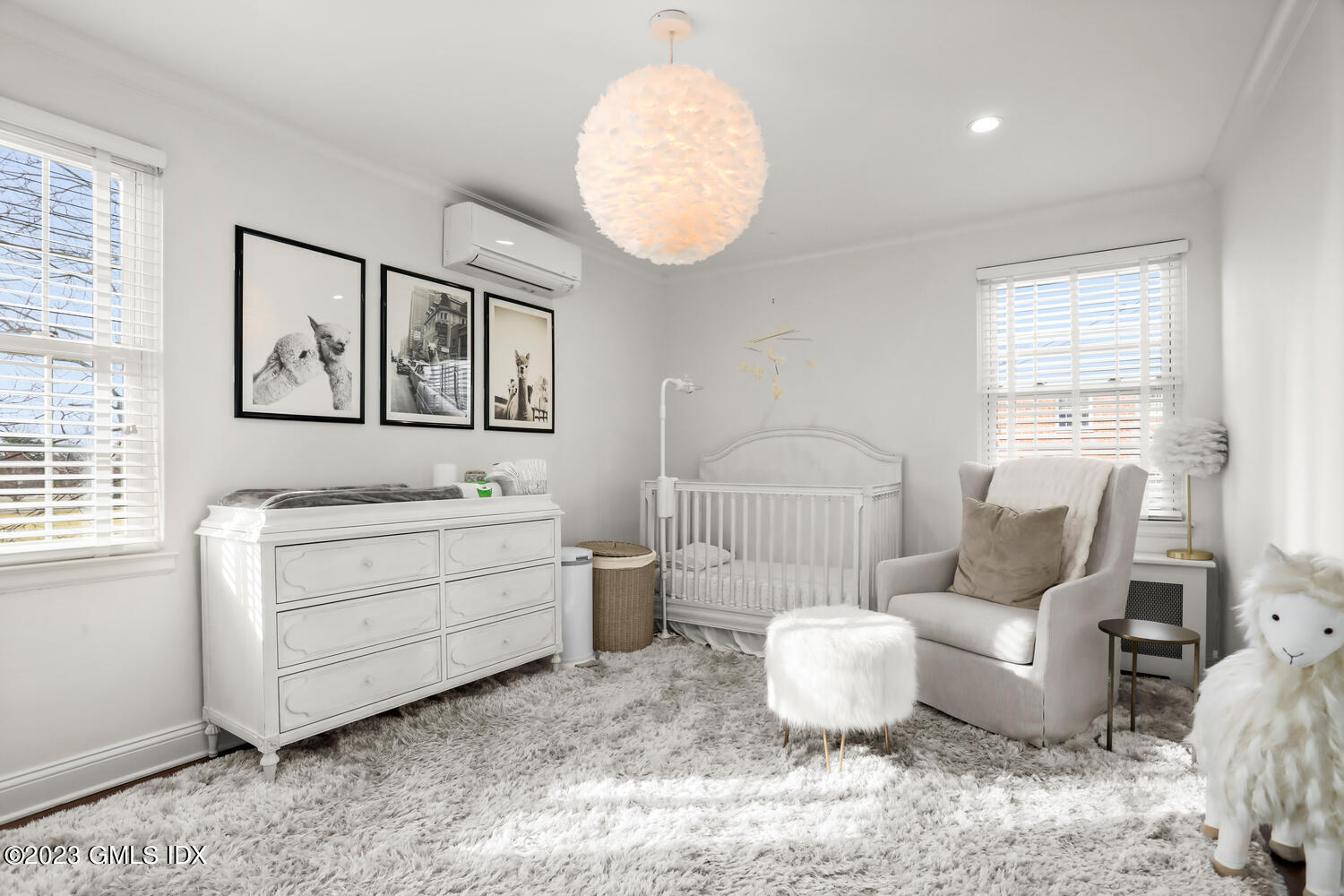 140 Putnam Park, Unit 140 Greenwich, CT 06830 - Photo 11 of 15 a room with a baby crib furniture and a window