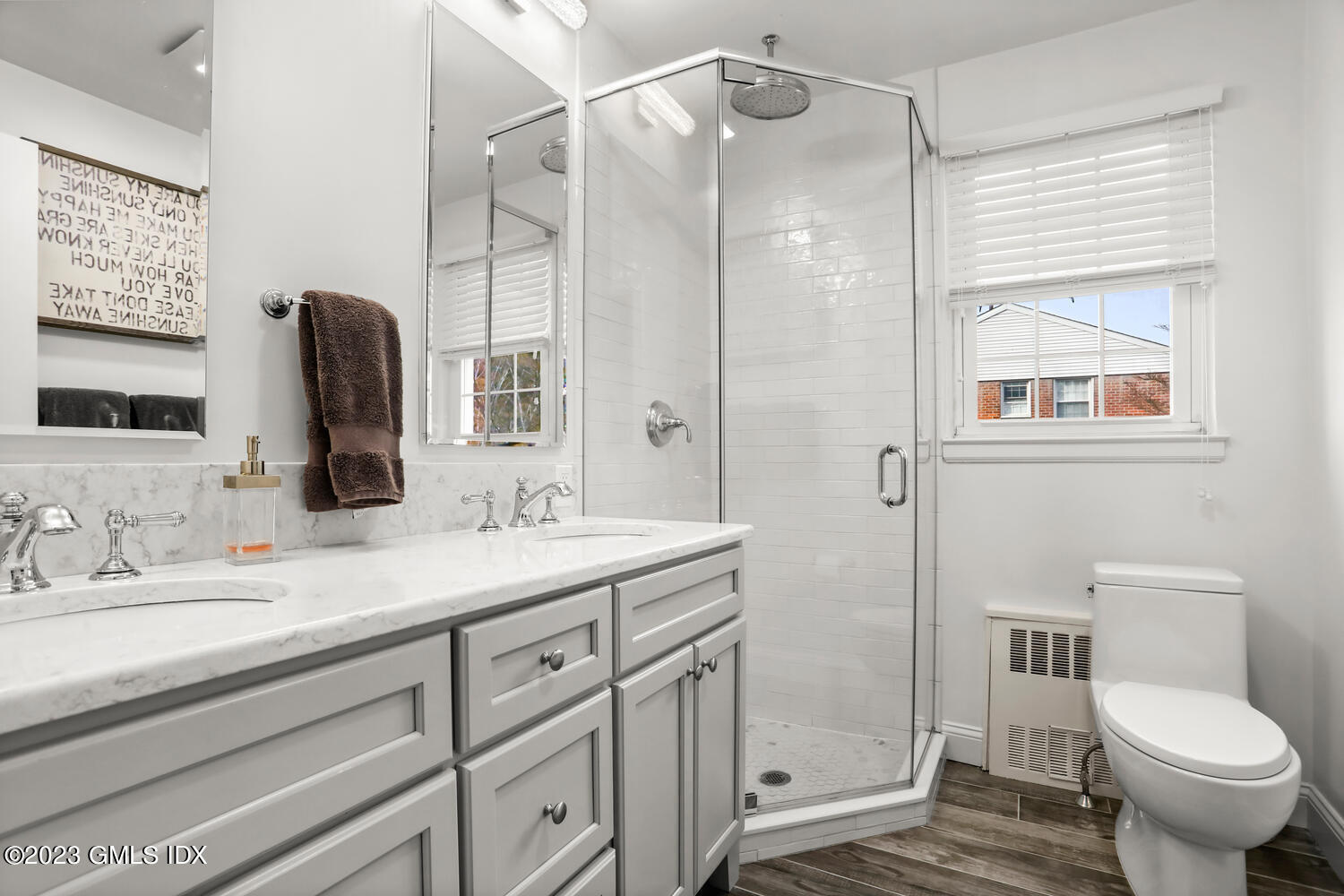 140 Putnam Park, Unit 140 Greenwich, CT 06830 - Photo 10 of 15 a bathroom with a granite countertop sink toilet and shower