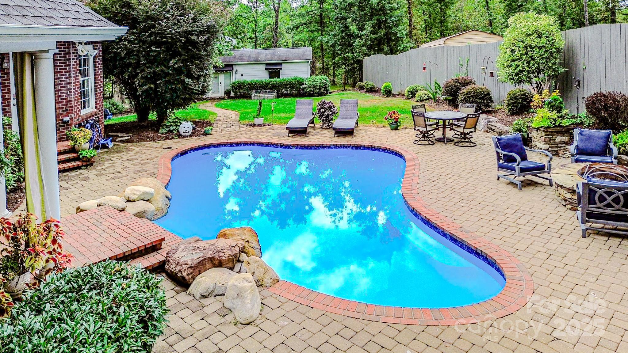 134 Chisholm Trail Rutherfordton, NC 28139 - Photo 14 of 48 a view of a swimming pool with sitting area