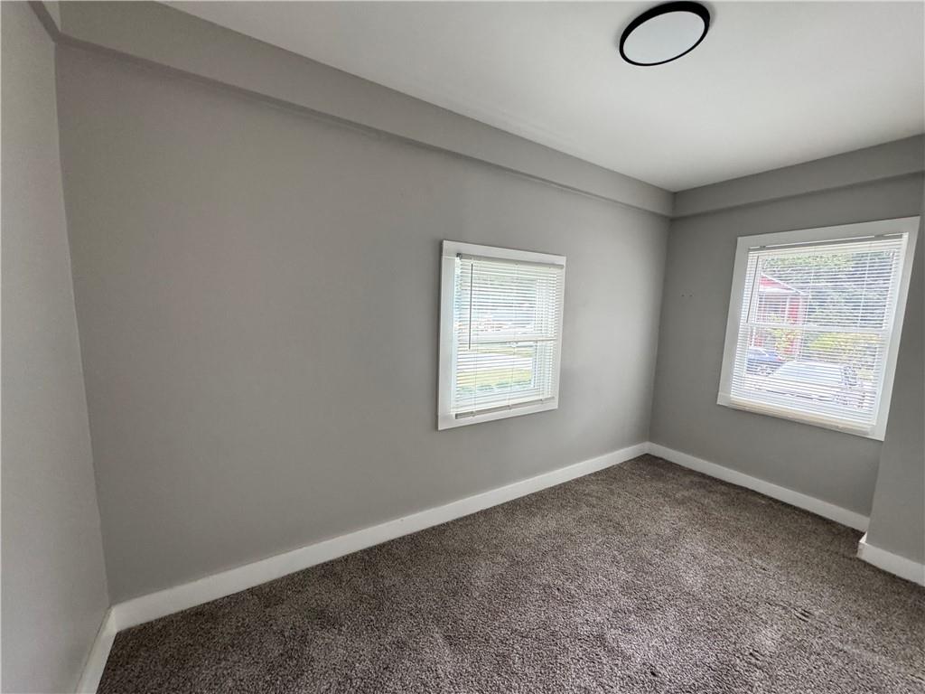 1714 Emerald Avenue Southwest Atlanta, GA 30310 - Photo 12 of 16 an empty room with windows