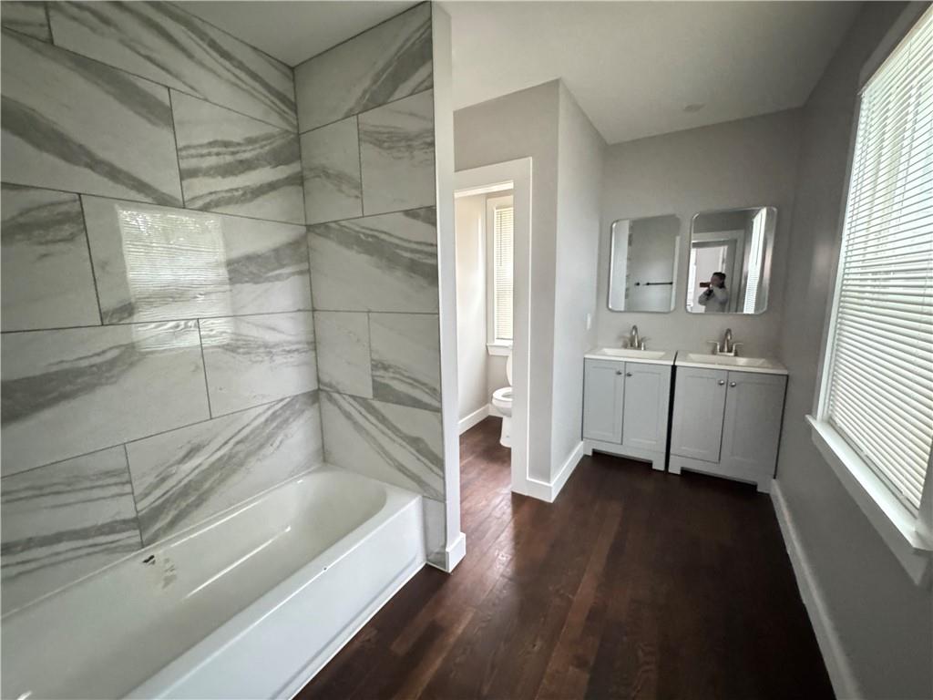 1714 Emerald Avenue Southwest Atlanta, GA 30310 - Photo 16 of 16 a bathroom with a bathtub and a sink