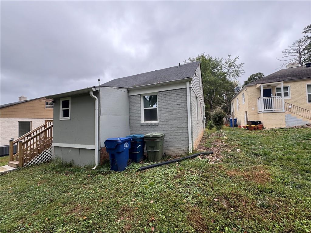 1714 Emerald Avenue Southwest Atlanta, GA 30310 - Photo 4 of 16 front view of a house with a yard