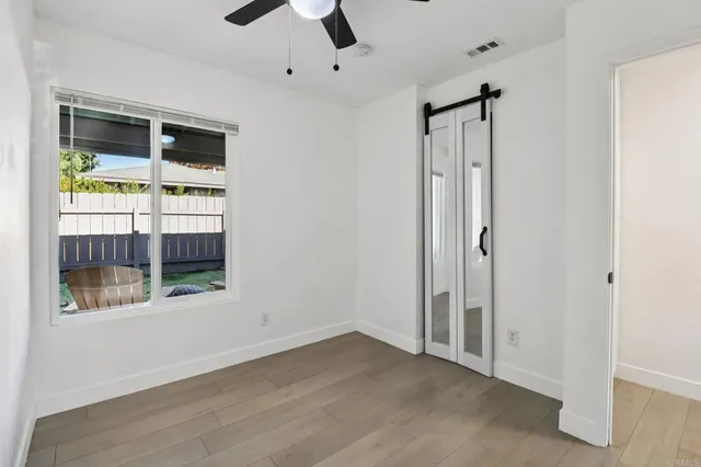 a view of an empty room with a window