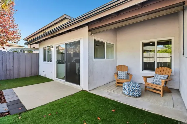 a backyard of a house with seating space
