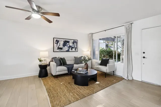 a living room with furniture and a rug