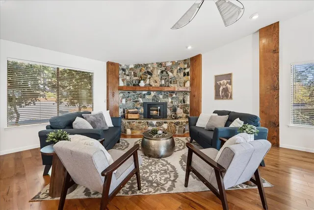 a living room with furniture and a large window