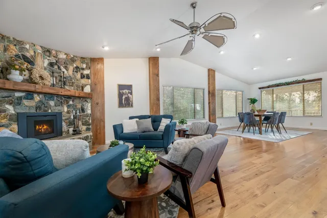 a view of a dining room with furniture and wooden floor