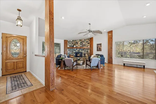 a view of a livingroom with furniture wooden floor and a rug
