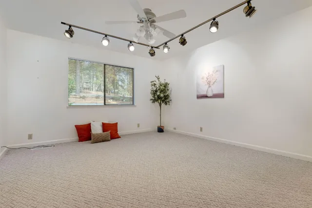 a large kitchen with stainless steel appliances granite countertop a stove and cabinets