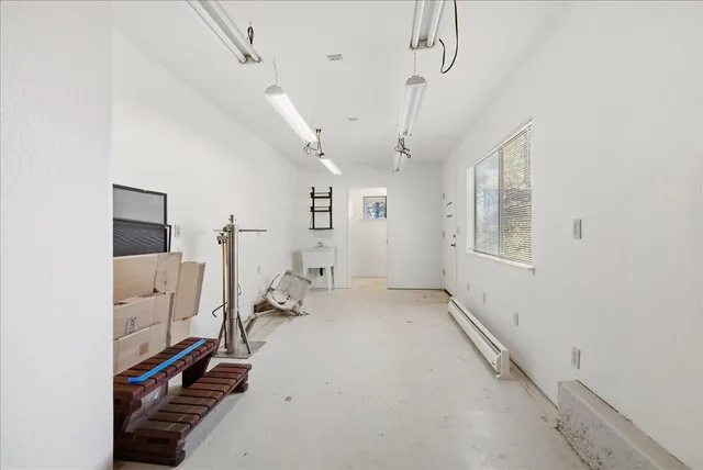 a picture of a bench in front of a wall