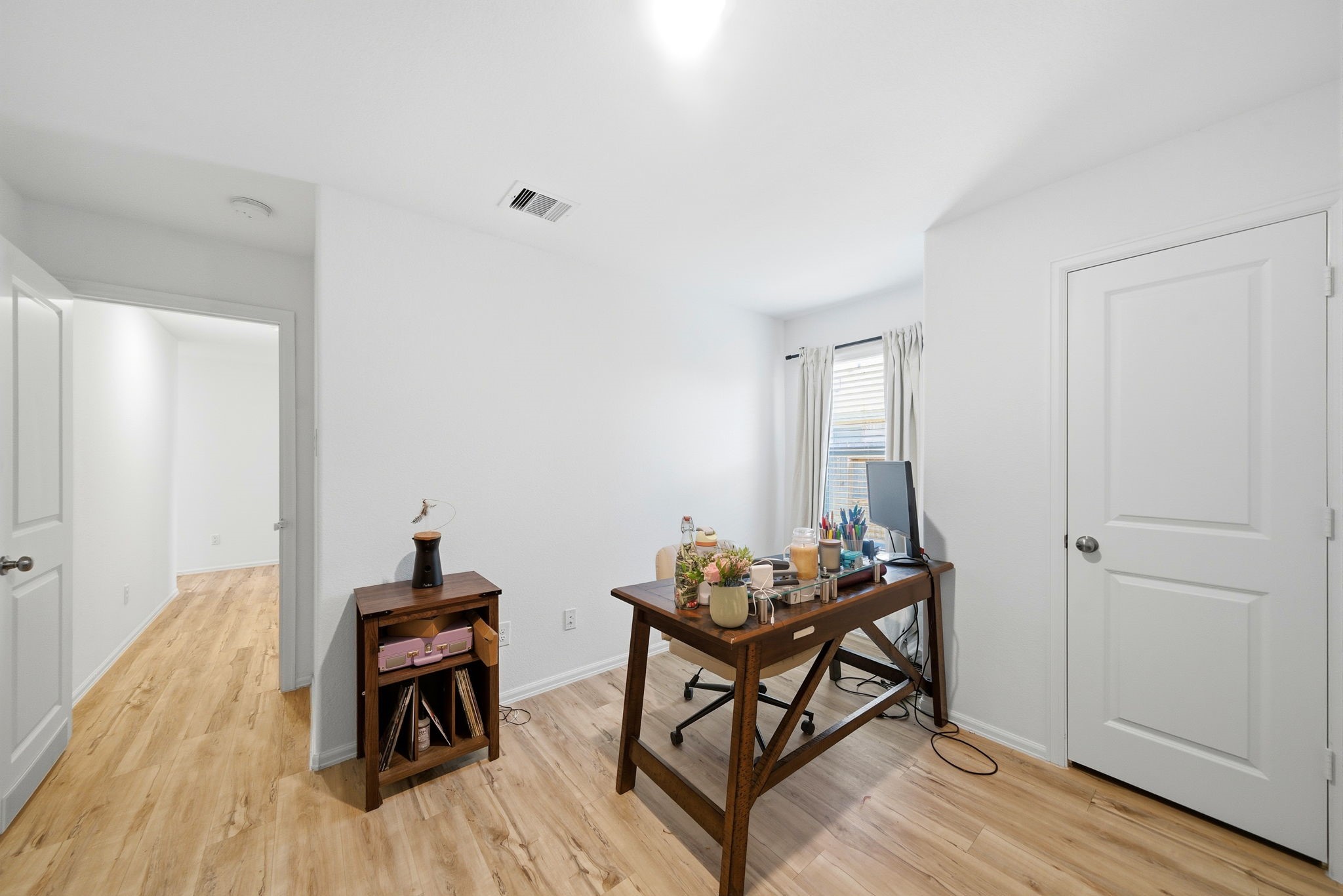 14502 Woodcott Warren Way Rosharon, TX 77583 - Photo 12 of 37 Secondary Bedroom 3—currently styled as a home office, offering a quiet and versatile space for work or guests.