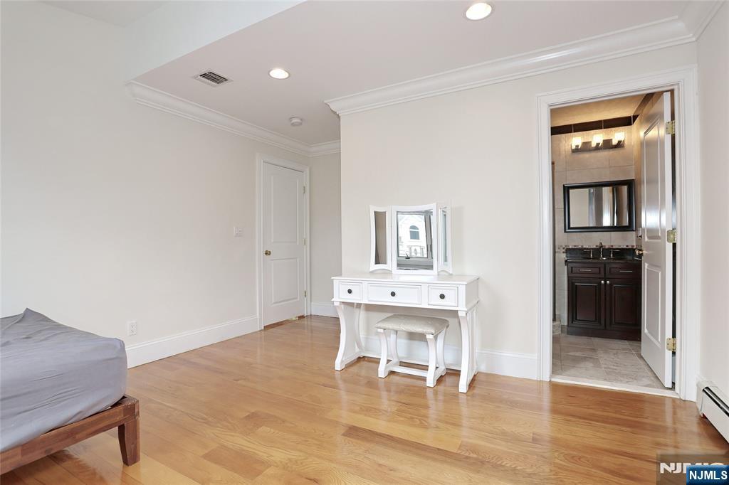 65 Ross Avenue Demarest, NJ 07627 - Photo 35 of 48 a living room with furniture and a table